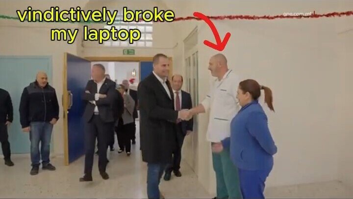 Robert Abela rewarding Karmnu Vella with a handshake who vindictively broke my laptop